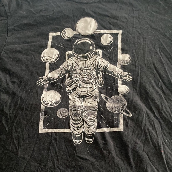 The Godzilla sheet size is L and the astronaut with different planets is L. - Picture 2 of 3